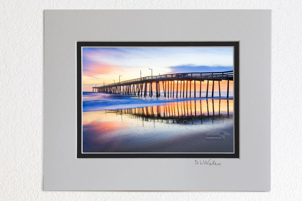 5 x 7 luster prints in a 8 x 10 ivory and black double mat of  Nags Head Fishing Pier at sunrise reflected in the wet sand beach on the Outer Banks of NC.