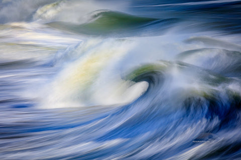 Huge waves captured with a slow shutter speed to show movement from the end of Avalon Fishing Pier in kill Devil Hills on the Outer Banks of North Carolina.