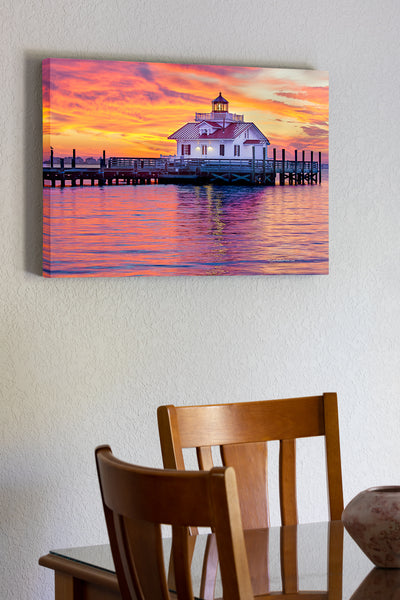 20"x30" x1.5" stretched canvas print hanging in the dining room of A fabulous sunrise at Roanoke Marshes Lighthouse on Shallow Bag Bay in Manteo North Carolina.