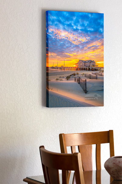 20"x30" x1.5" stretched canvas print hanging in the dining room of  Sand dunes and sand fence at sunrise at Jennette's Pier in Nags Head on the Outer Banks of NC.