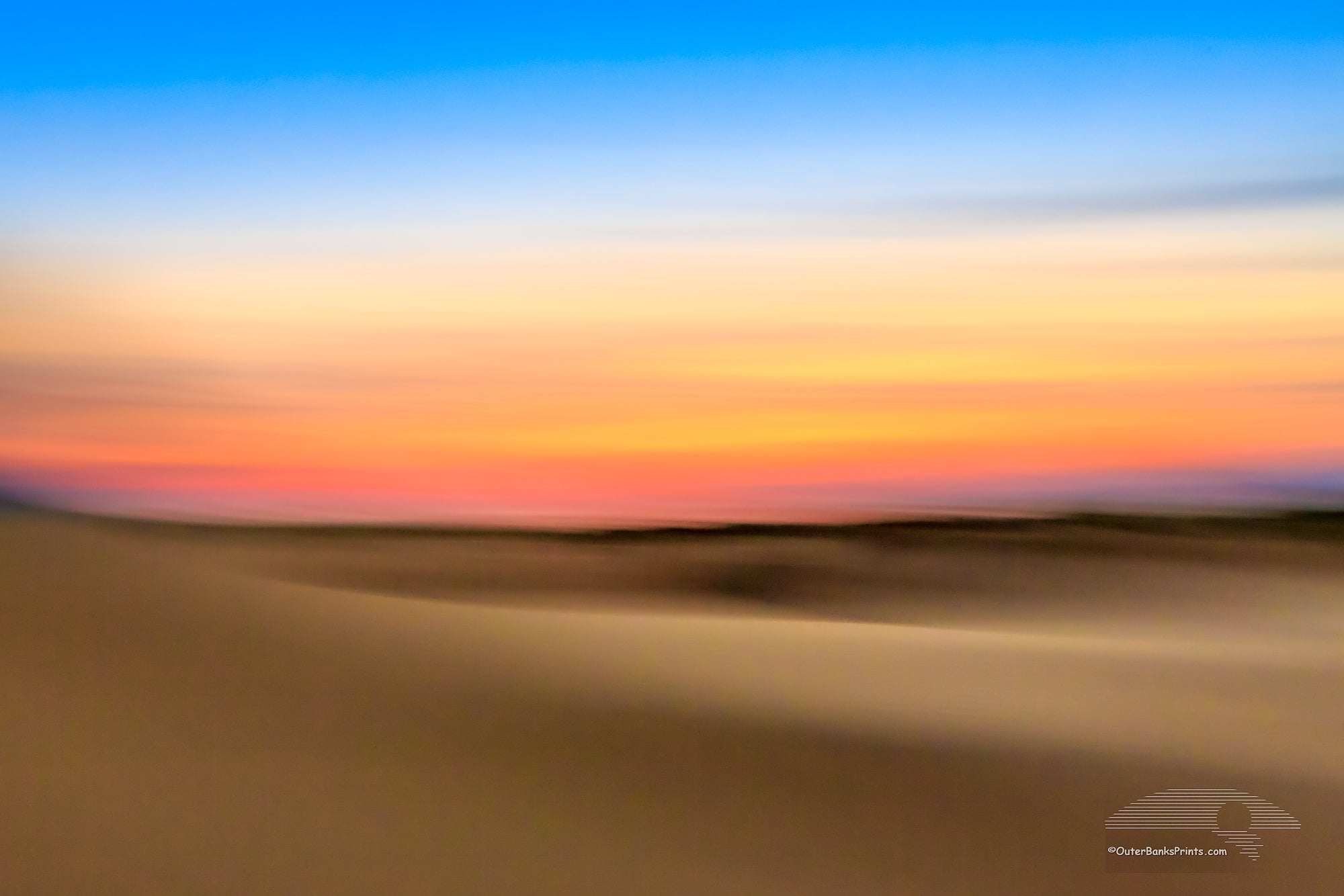 An impression of Jockey's Ridge State Park at sunset. Moving the camera while the shutter is open creates impressionistic photographs.