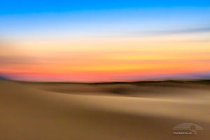An impression of Jockey's Ridge State Park at sunset. Moving the camera while the shutter is open creates impressionistic photographs.