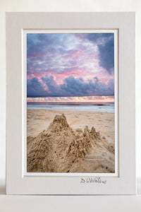 4 x 6 luster print in a 5 x 7 ivory mat of  Sandcastle beneath an incredible sunrise sky on the Outer Banks of NC.