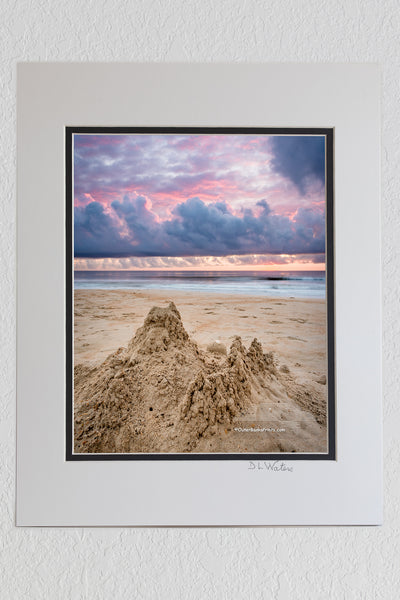 5 x 7 luster prints in a 8 x 10 ivory and black double mat of Sandcastle beneath an incredible sunrise sky on the Outer Banks of NC.