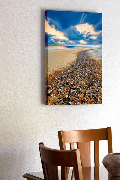 20"x30" x1.5" stretched canvas print hanging in the dining room of Long exposure of a trail of shell shards washed up on the high tide at Kitty Hawlk Outer Banks beach Christmas morning.