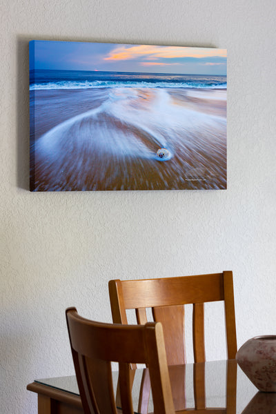 20"x30" x1.5" stretched canvas print hanging in the dining room of Beach, surf, sunrise and whelk shell on the Outer Banks, NC.