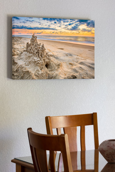 20"x30" x1.5" stretched canvas print hanging in the dining room of A drip sandcastle at sunrise on an Outer Banks beach.