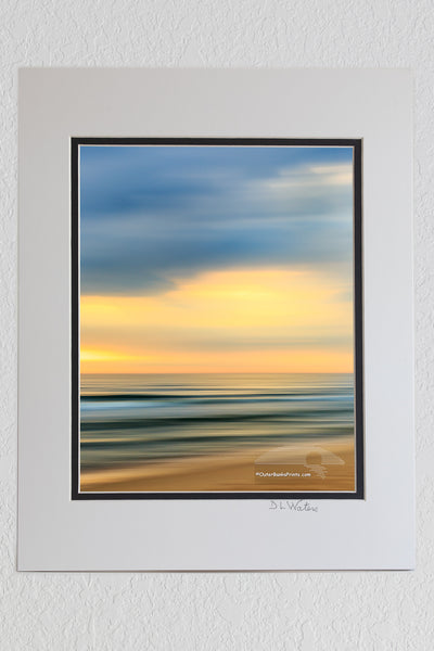 8 x 10 luster print in a 11 x 14 ivory and black double mat of Moving the camera during exposure turns this Kitty Hawk beach scene into a kaleidoscope of colors.