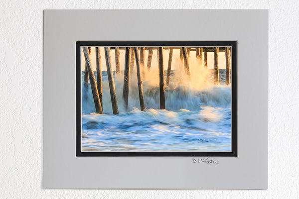 5 x 7 luster prints in a 8 x 10 ivory and black double mat of  A long exposure and crashing waves created this photo of the Outer Banks Pier in South Nags Head.