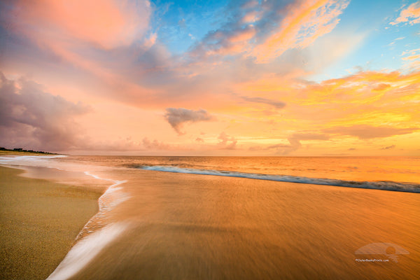 Soft surf at sunrise on Kitty Hawk Beach, Outer Banks North Carolina.