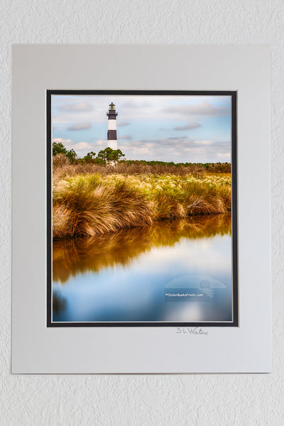 8 x 10 luster print in a 11 x 14 ivory and black double mat of A long 30 second exposure results in a unusual photograph of Bodie IIsland Lighthouse on the Outer Banks.
