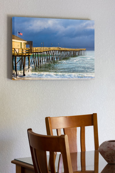 20"x30" x1.5" stretched canvas print hanging in the dining room of Sunshine on Avalon Fishing Pier on a stormy afternoon at the Outer Banks of North Carolina.