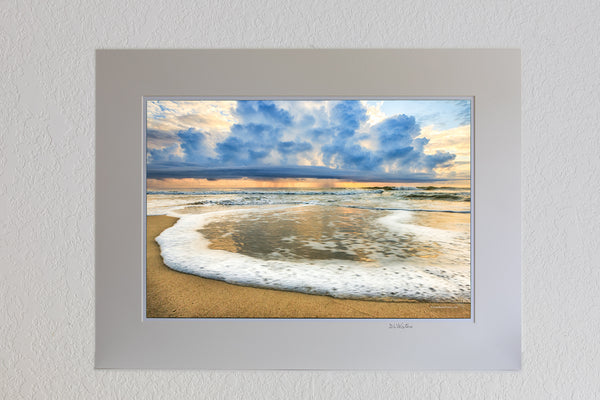13 x 19 luster print in 18 x 24 ivory ￼￼mat of Surf foam rolling in and a rain storm out to sea on the Outer Banks of NC.