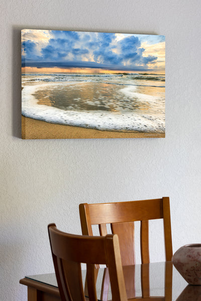 20"x30" x1.5" stretched canvas print hanging in the dining room of Surf foam rolling in and a rain storm out to sea on the Outer Banks of NC.