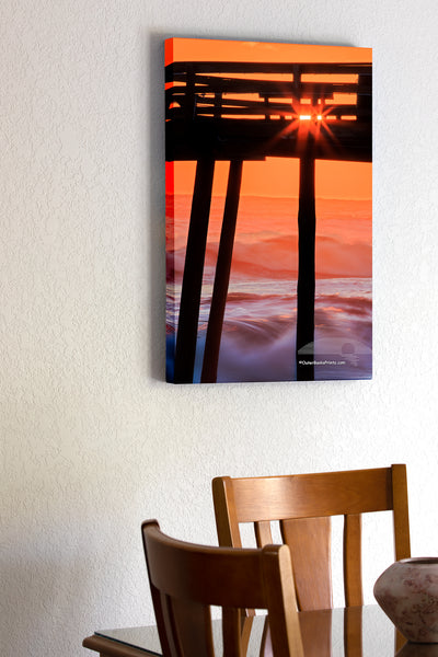 20"x30" x1.5" stretched canvas print hanging in the dining room of Avalon fishing silhouetted against breaking waves at sunrise.