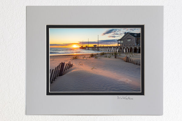 5 x 7 luster prints in a 8 x 10 ivory and black double mat of  Early morning light stretches across the dunes at Jennette's Pier in Nags Head on the Outer Banks of North Carolina.