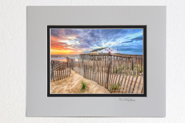 5 x 7 luster prints in a 8 x 10 ivory and black double mat of  Sand fence at sunrise in front of Kitty Hawk Fishing Pier on the Outer Banks.