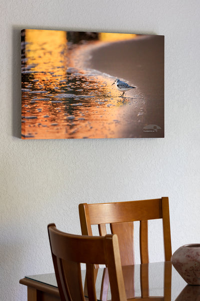 20"x30" x1.5" stretched canvas print hanging in the dining room of Sandpiper with the colorful sunrise reflected in the surf at Avalon Fishing Pier in Kill Devil Hills on the Outer Banks of NC.