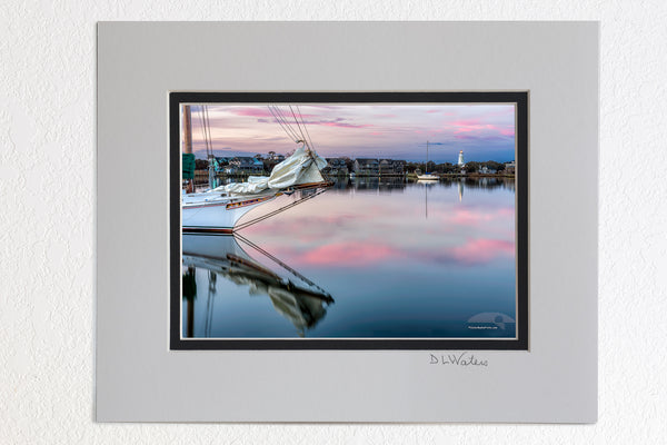  5 x 7 luster prints in a 8 x 10 ivory and black double mat of  Sail boat and reflection at twilight on Silver Lake Ocracoke Island, Outer Banks, NC.