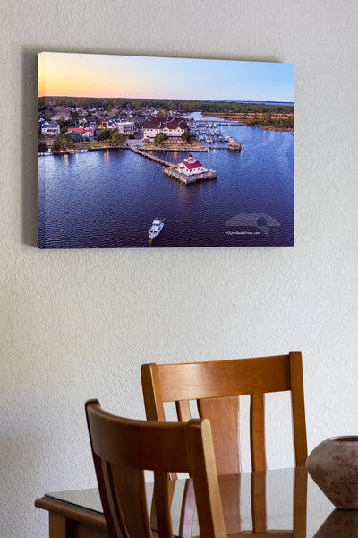 20"x30" x1.5" stretched canvas print hanging in the dining room of Aerial view of Roanoke Marshes Lighthouse and the quaint town of Manteno NC.