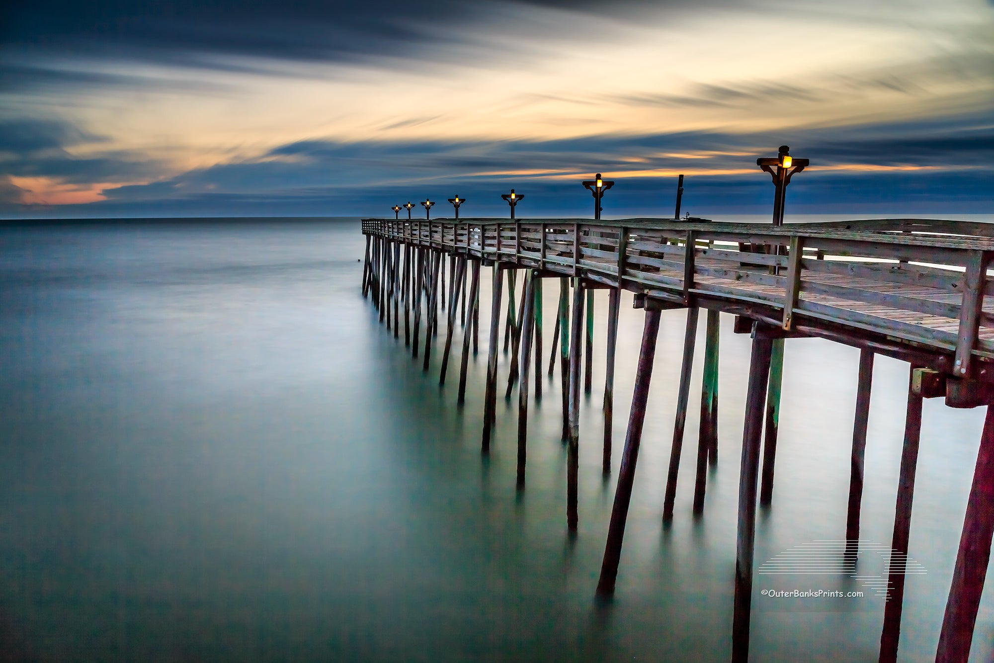 Long exposure of Kitty Hawk Pier at sunrise on the Outer Banks of NC.