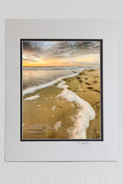 8 x 10 luster print in a 11 x 14 ivory and black double mat of Cloudy sunrise at Carova Beach on the northern Outer Banks.
