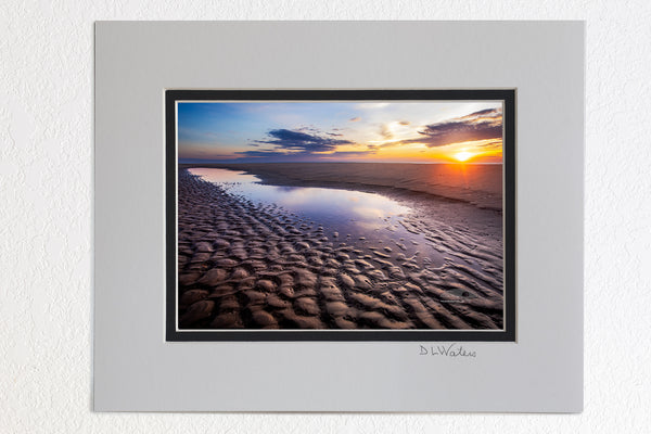 5 x 7 luster prints in a 8 x 10 ivory and black double mat of  Sunrise reflection in a tide pool on a Corolla beach at Outer Banks, NC.