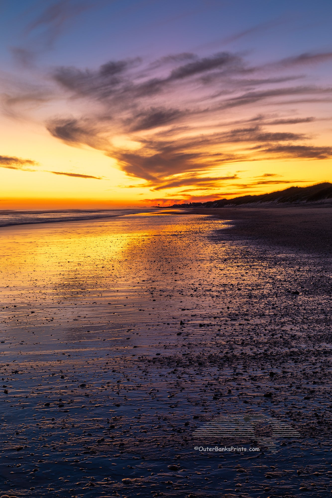 Just after sunset along Frico beach in Cape Hatteras National Seashore. Because the way Cape Point stretches out into the Atlantic ocean Frisco beach is one of the few places on the Outer Banks the sun rises and sets along the beach.