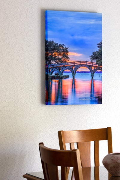 20"x30" x1.5" stretched canvas print hanging in the dining room of Twilight reflection of the wooden bridge that connects the Whale Head Club to Currituck Beach Lighthouse.
