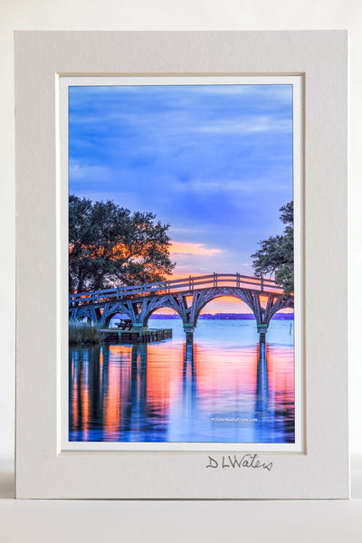 4 x 6 luster print in a 5 x 7 ivory mat of Twilight reflection of the wooden bridge that connects the Whale Head Club to Currituck Beach Lighthouse.