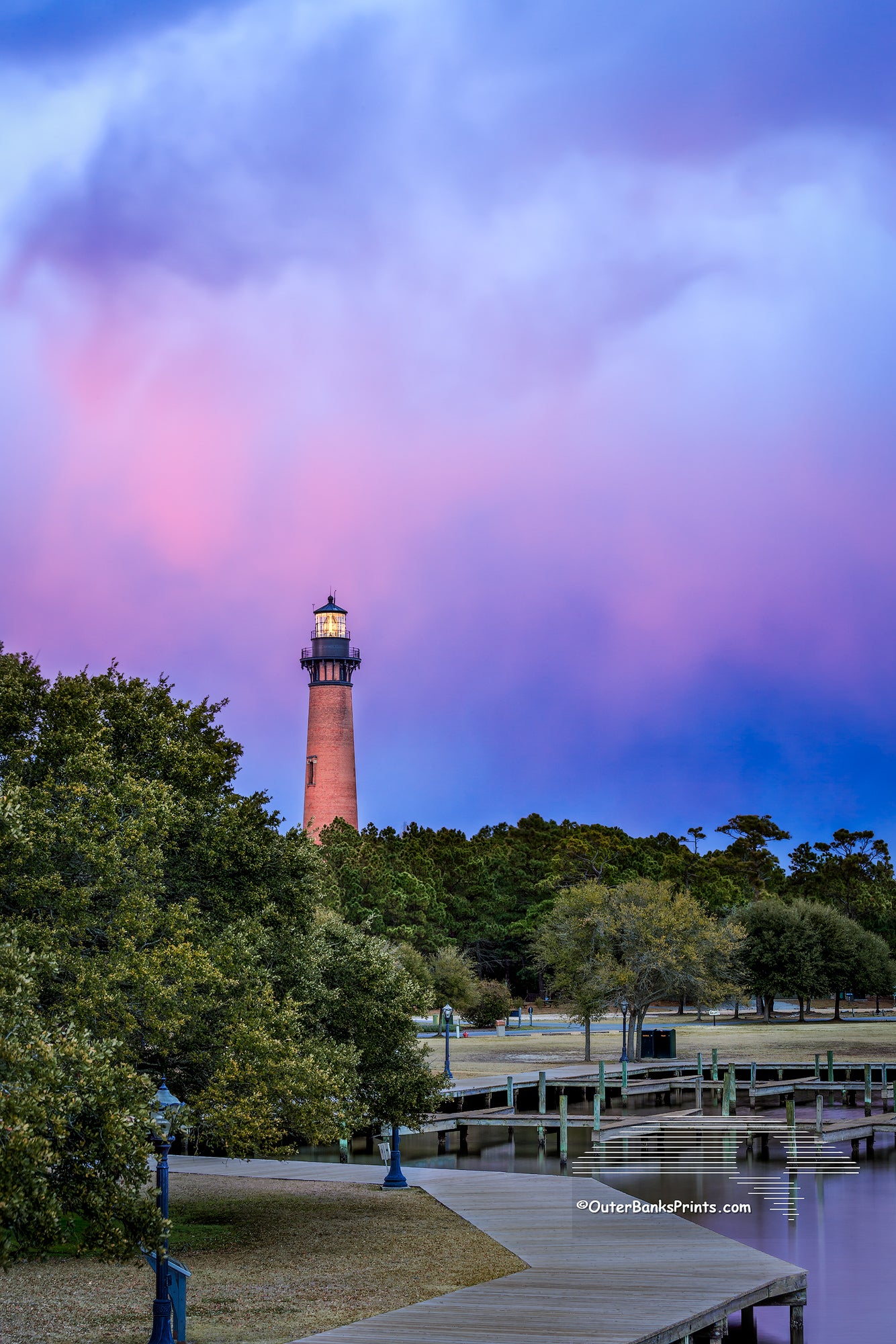 Currituck Beach Lighthouse captured at twilight from the top of the wooden bridge that connects the  Whale Head Club to the lighthouse.