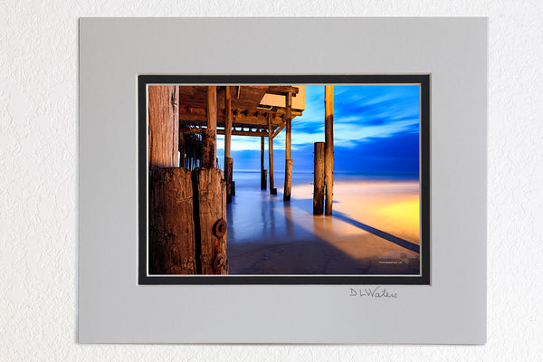 5 x 7 luster prints in a 8 x 10 ivory and black double mat of  Twilight at Kitty Hawk Pier, Outer Banks NC. Twilight at Kitty Hawk Pier, Outer Banks NC.