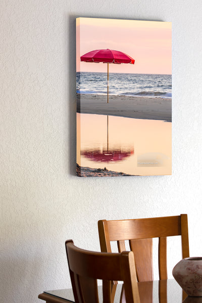 20"x30" x1.5" stretched canvas print hanging in the dining room of Lonely umbrella reflected in a tide pool at a Duck, NC beach on the Outer Banks.