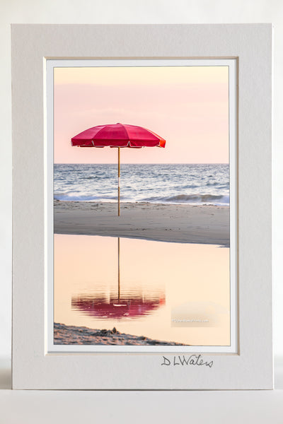 4 x 6 luster print in a 5 x 7 ivory mat of Lonely umbrella reflected in a tide pool at a Duck, NC beach on the Outer Banks.