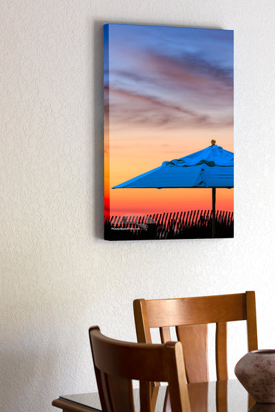 20"x30" x1.5" stretched canvas print hanging in the dining room of Beach umbrella at sunrise on the Outer Banks.