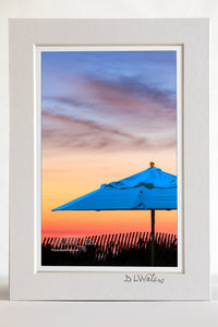 4 x 6 luster print in a 5 x 7 ivory mat of Beach umbrella at sunrise on the Outer Banks.
