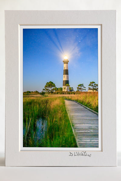 4 x 6 luster print in a 5 x 7 ivory mat of Bodie Island Lighthouse and boardwalk through marsh at night on Hatteras Island National Seashore.