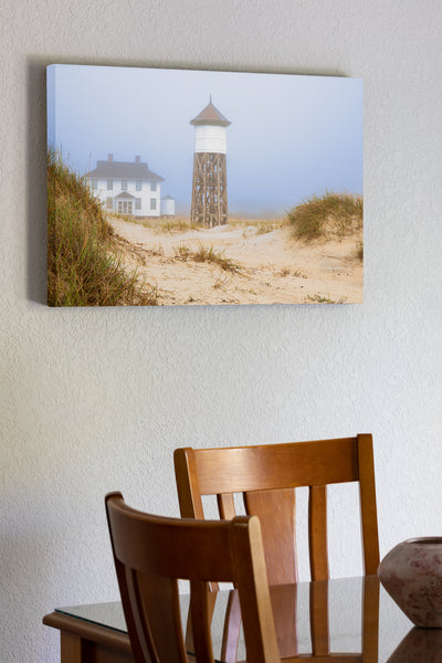 20"x30" x1.5" stretched canvas print hanging in the dining room of  A foggy morning at Washed Woods US Coast Guard station number 166, in Carova Beach on the Outer Banks of North Carolina.