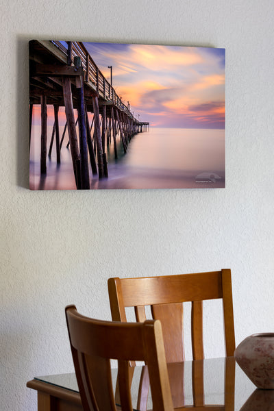 20"x30" x1.5" stretched canvas print hanging in the dining room of A long, 181 second, exposure of Avalon Fishing Pier on the Outer Banks, NC.