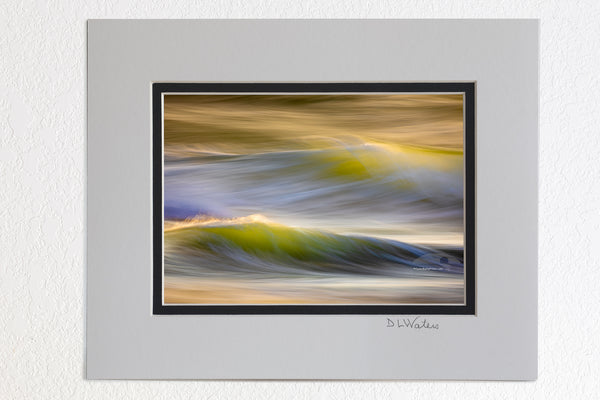 5 x 7 luster prints in a 8 x 10 ivory and black double mat of  Photographed with a long exposure capturing the light playing off of the moving surf at Kitty Hawk, NC on the outer Banks.