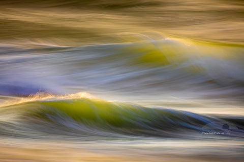 Photographed with a long exposure capturing the light playing off of the moving surf at Kitty Hawk, NC on the outer Banks.