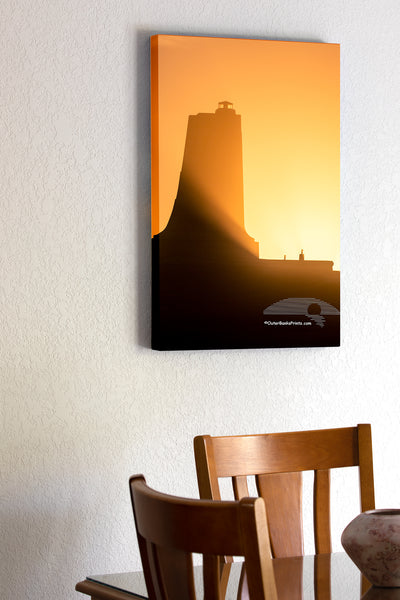 20"x30" x1.5" stretched canvas print hanging in the dining room of Shadow and sunlight at the Wright Brothers National Memorial in Kill Devil Hills, NC on the Outer Banks.