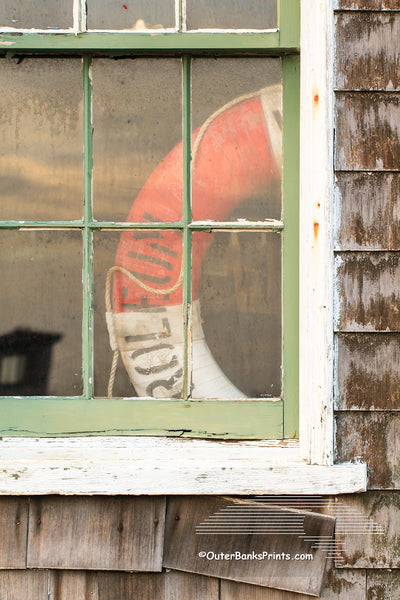 Picture of a old window and lifesaver at Chicamacomico Lifesaving Satiation on Hatteras Island.