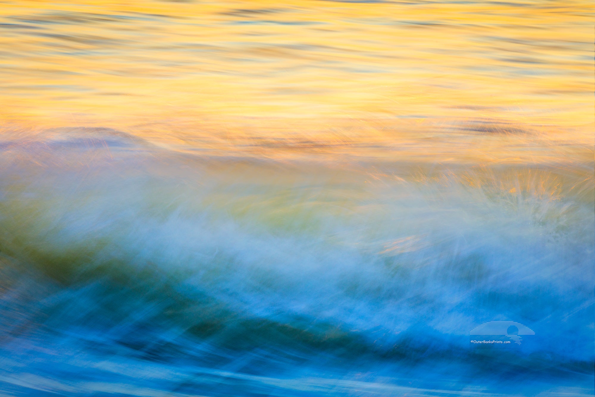 Moving wave impression at sunrise on the Outer Banks of North Carolina.